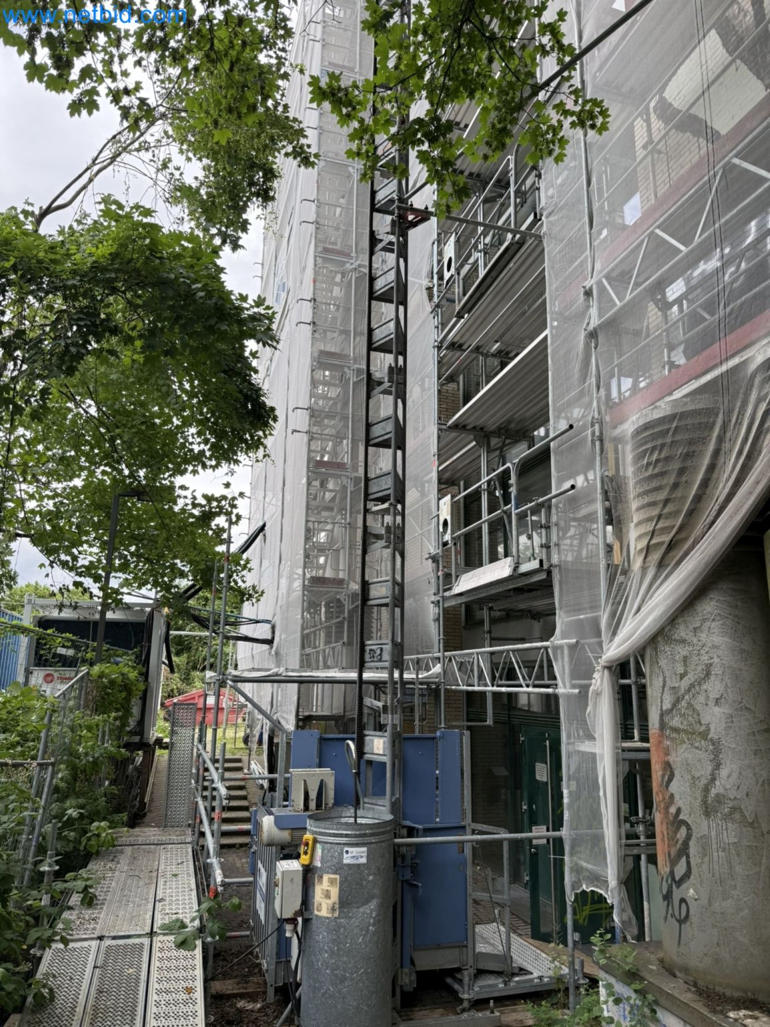 Scaffolding components (some from the construction site), machinery, and vehicles belonging to a construction company-1