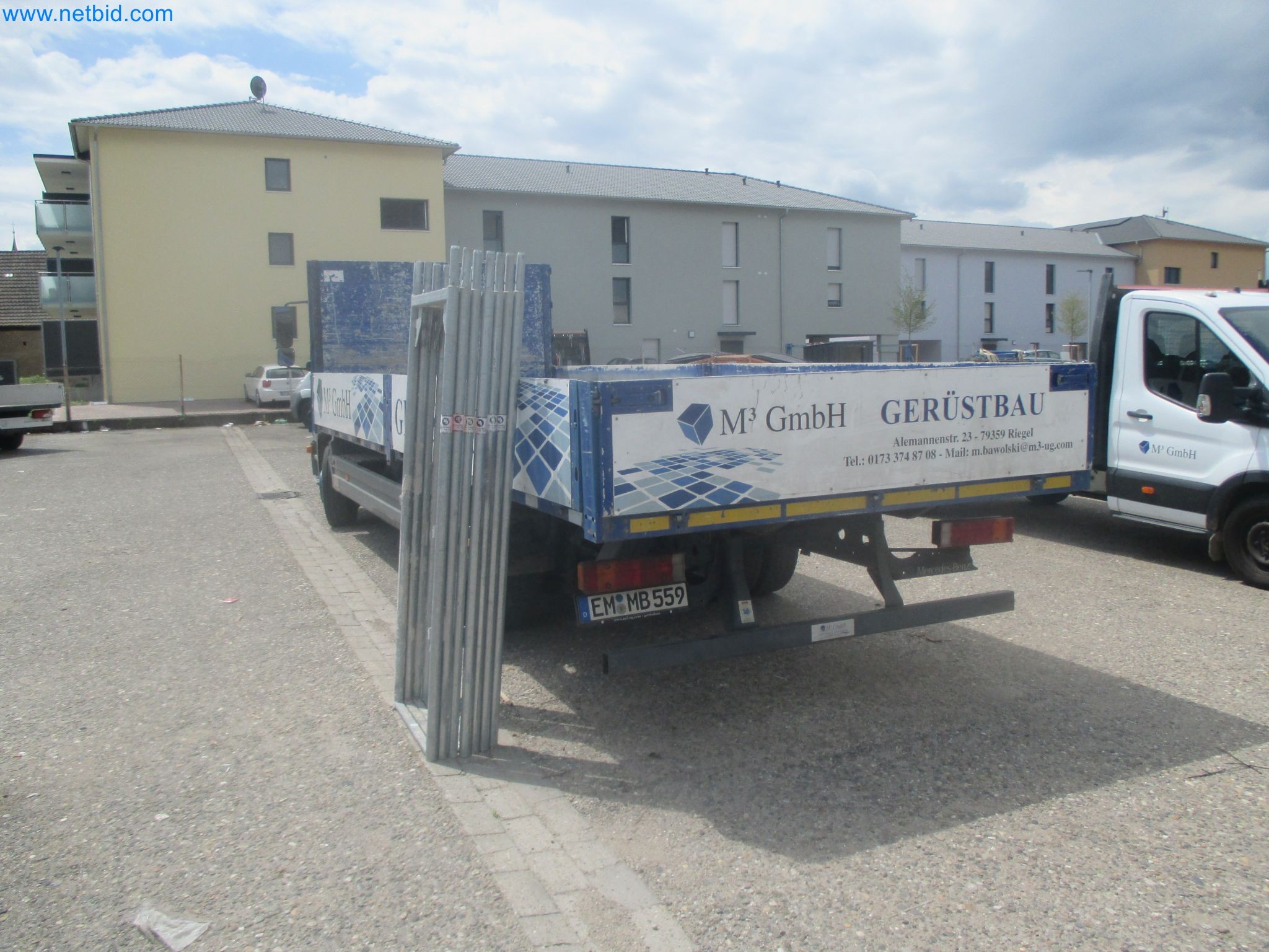 Scaffolding components (some from the construction site), machinery, and vehicles belonging to a construction company-7
