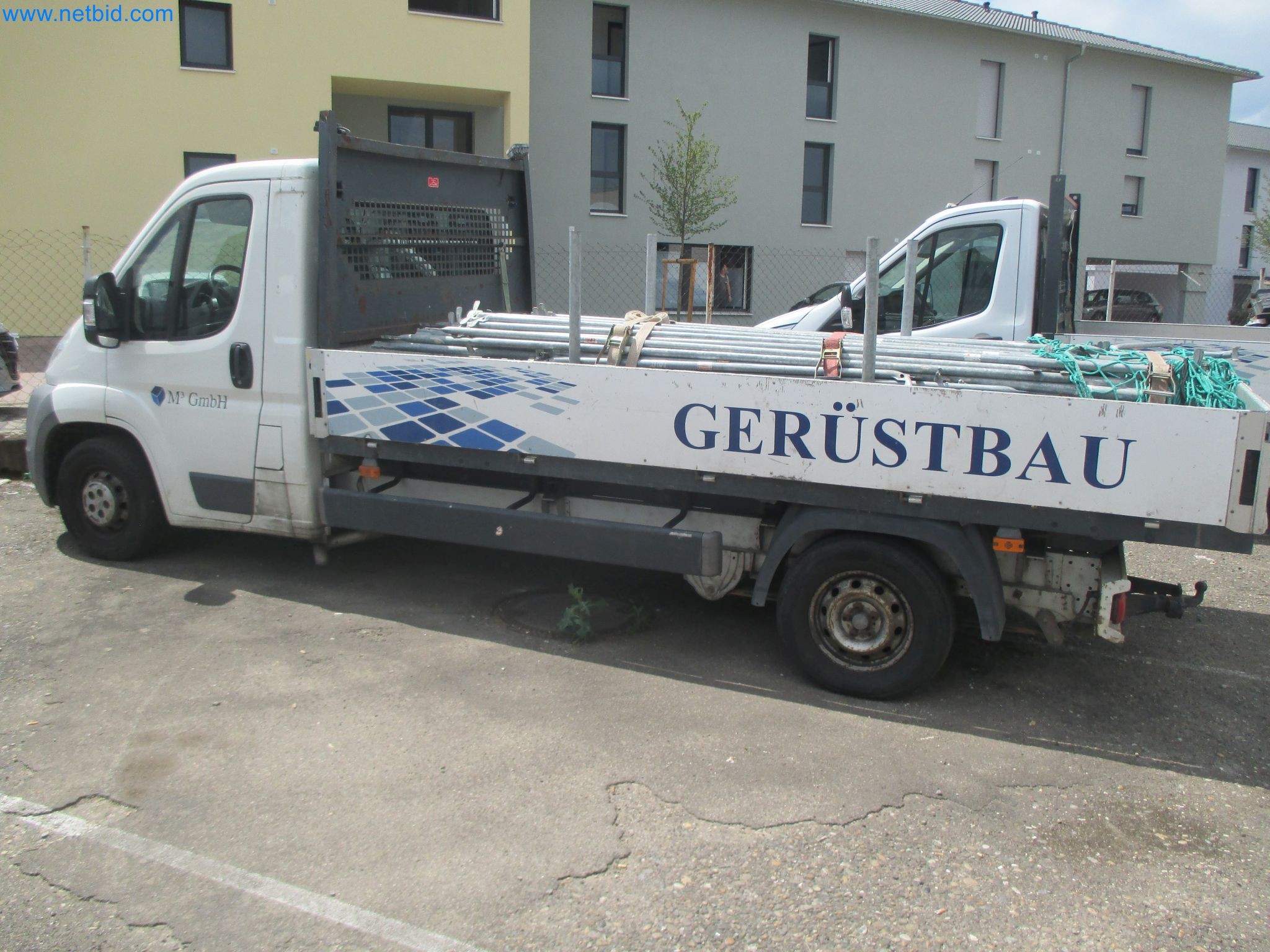 Scaffolding components (some from the construction site), machinery, and vehicles belonging to a construction company-2