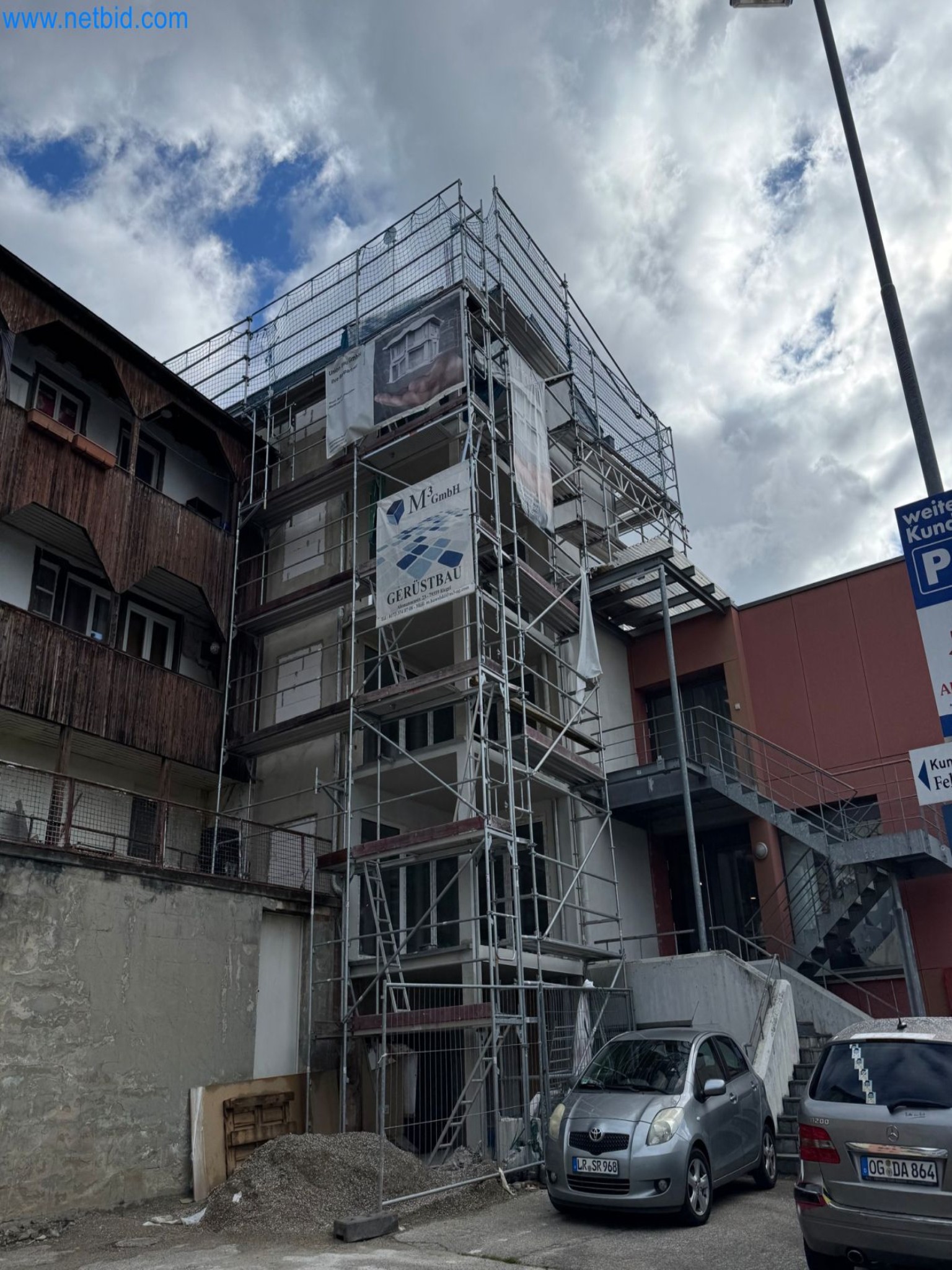 Scaffolding components (some from the construction site), machinery, and vehicles belonging to a construction company-2