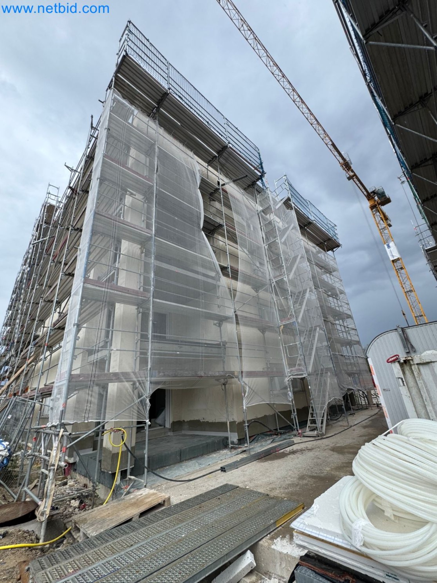 Scaffolding components (some from the construction site), machinery, and vehicles belonging to a construction company-3