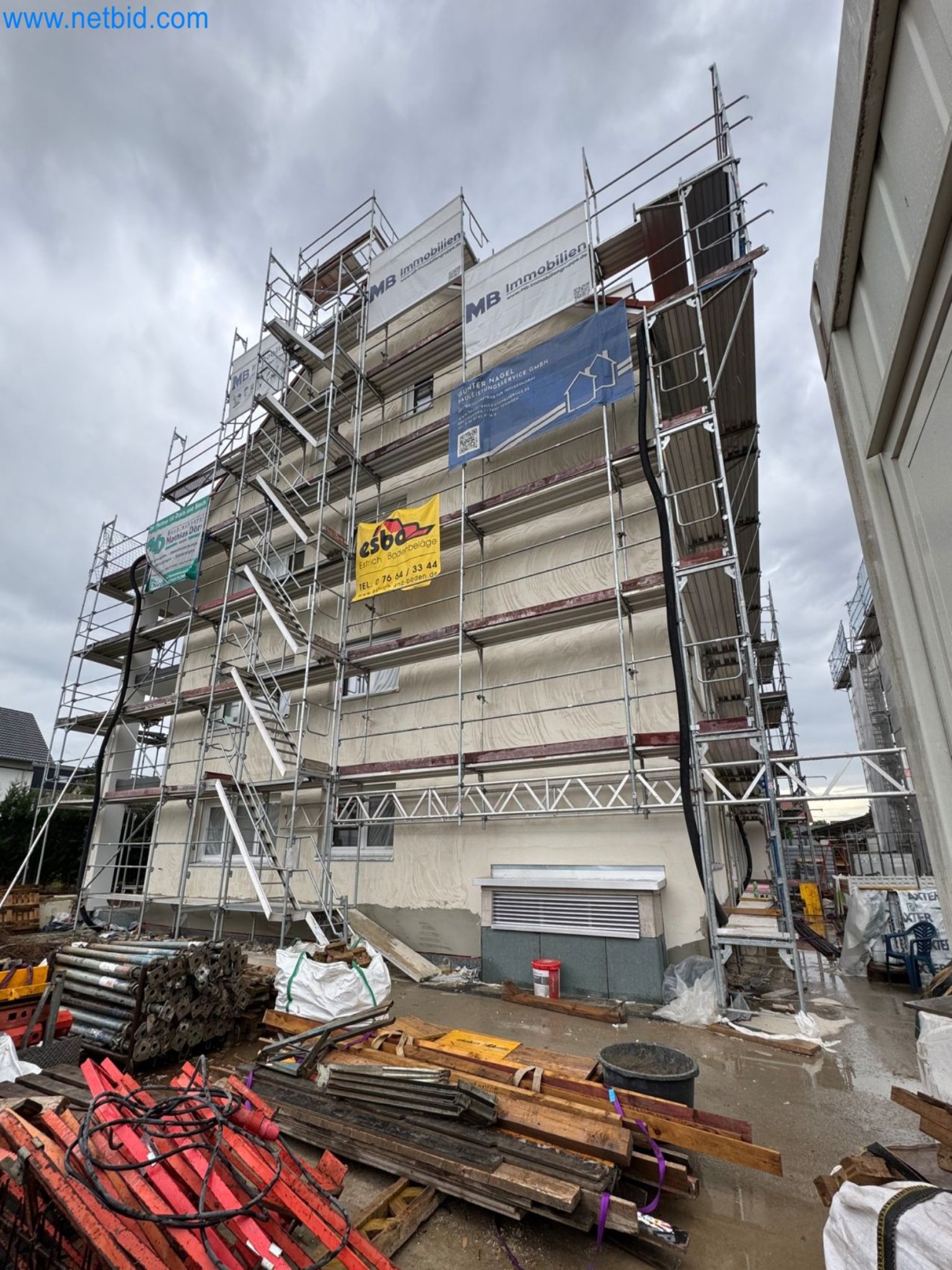 Scaffolding components (some from the construction site), machinery, and vehicles belonging to a construction company-6