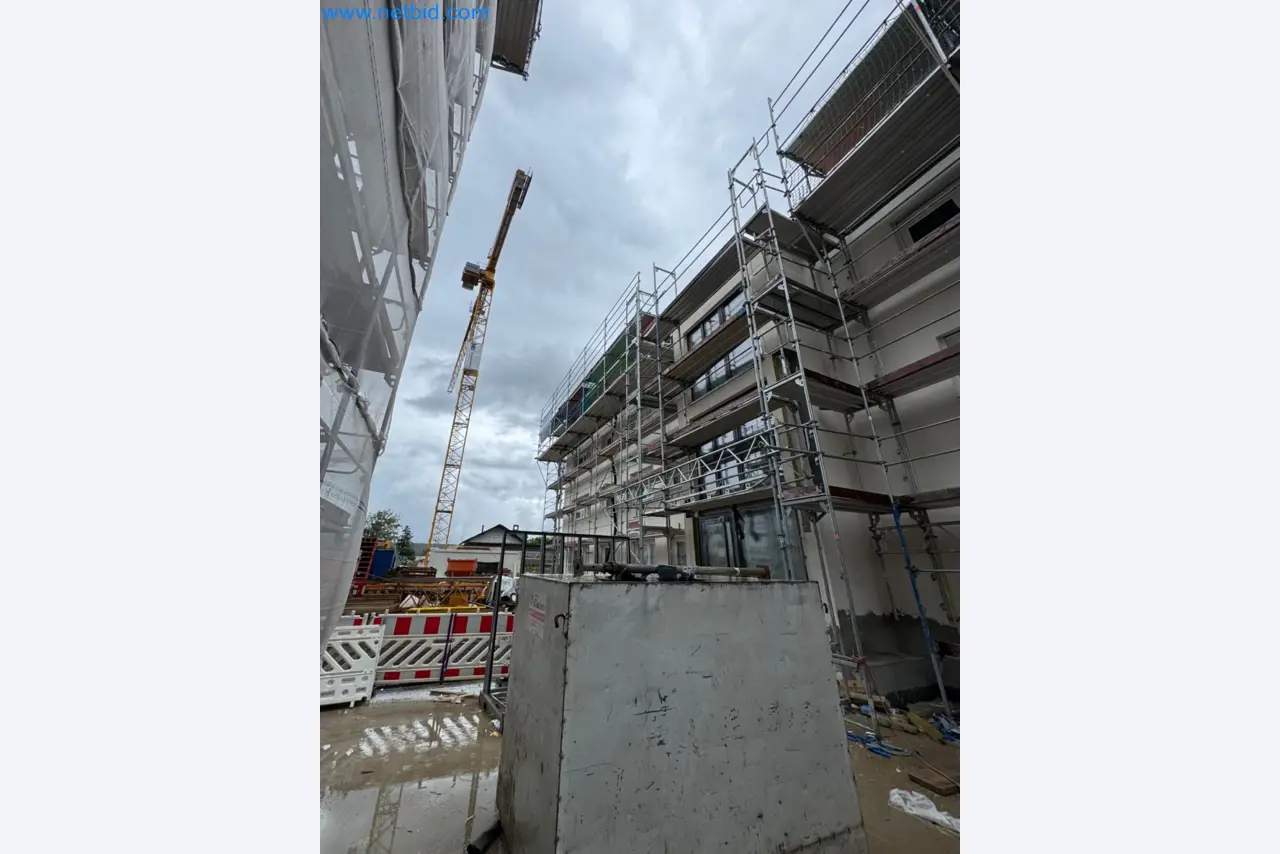 Scaffolding components (some from the construction site), machinery, and vehicles belonging to a construction company-7