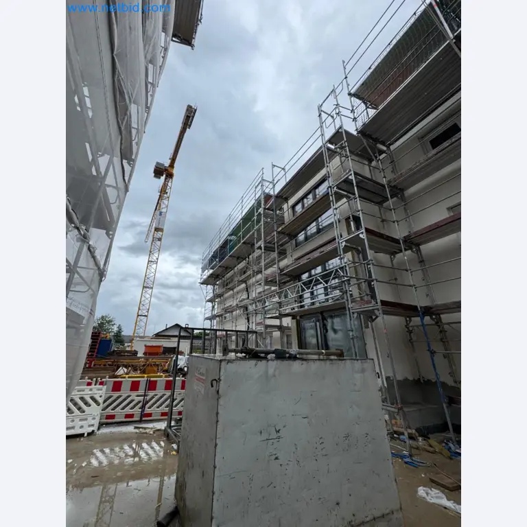 Scaffolding components (some from the construction site), machinery, and vehicles belonging to a construction company-7