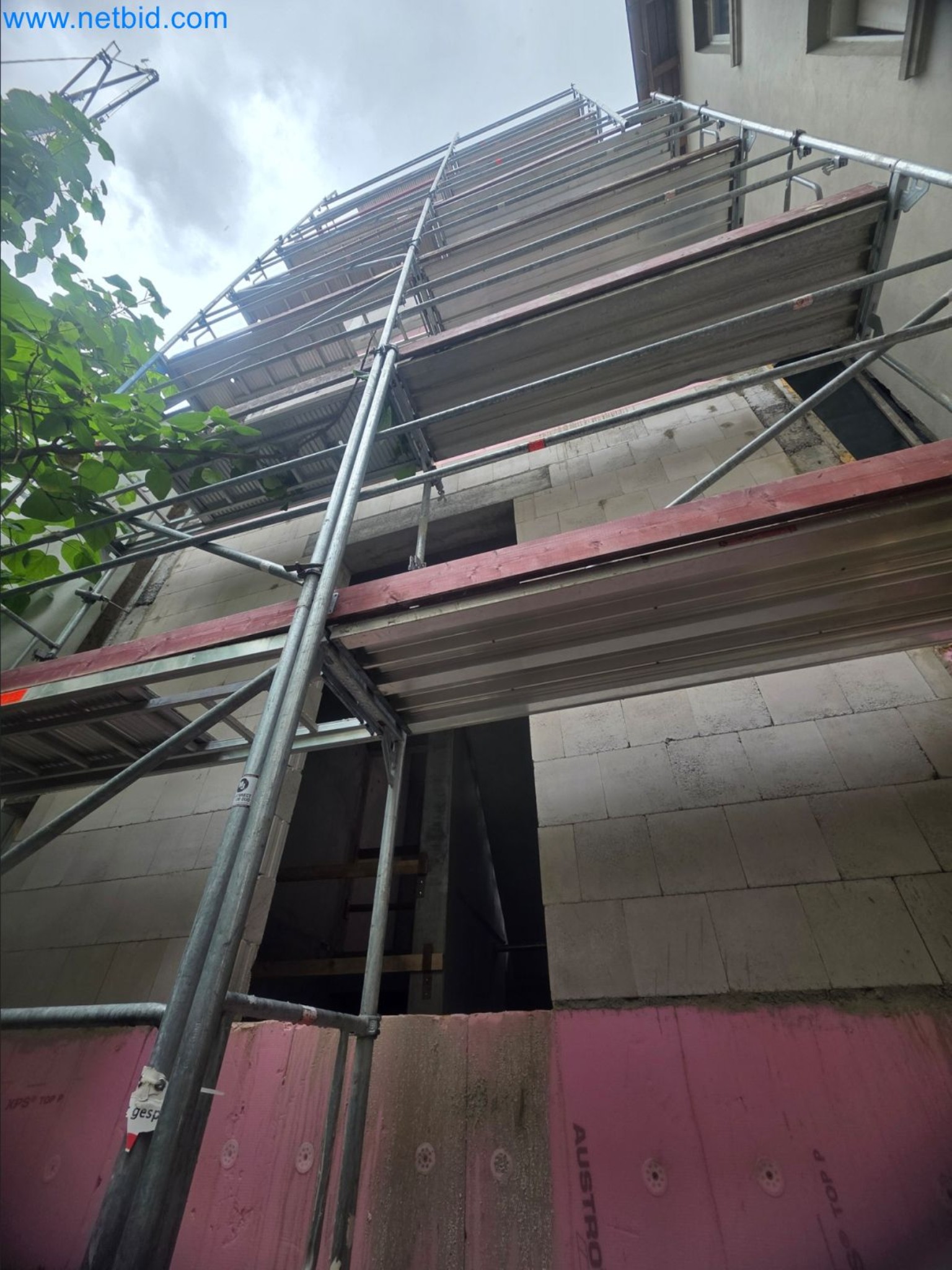 Scaffolding components (some from the construction site), machinery, and vehicles belonging to a construction company-1