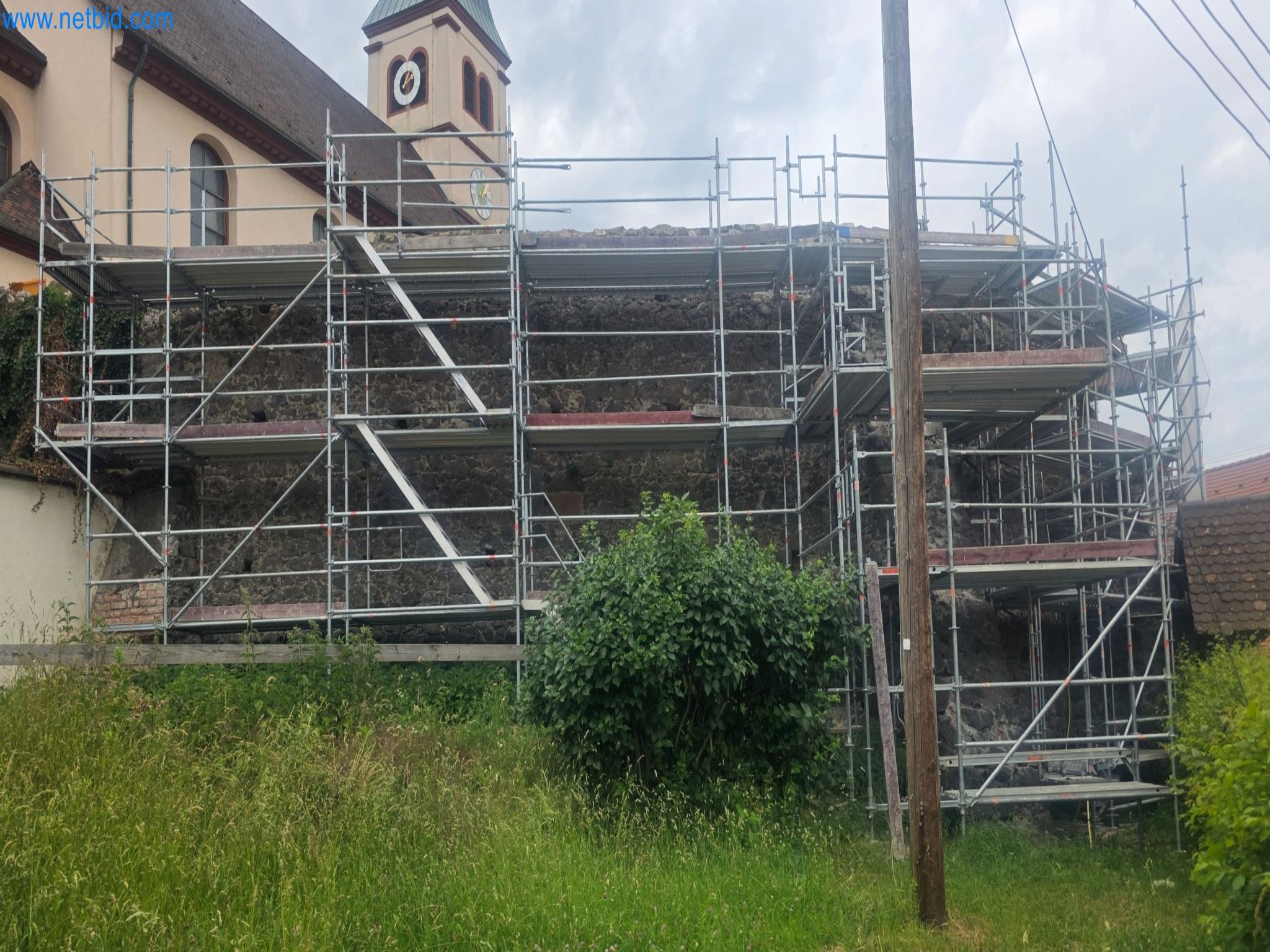 Scaffolding components (some from the construction site), machinery, and vehicles belonging to a construction company-1
