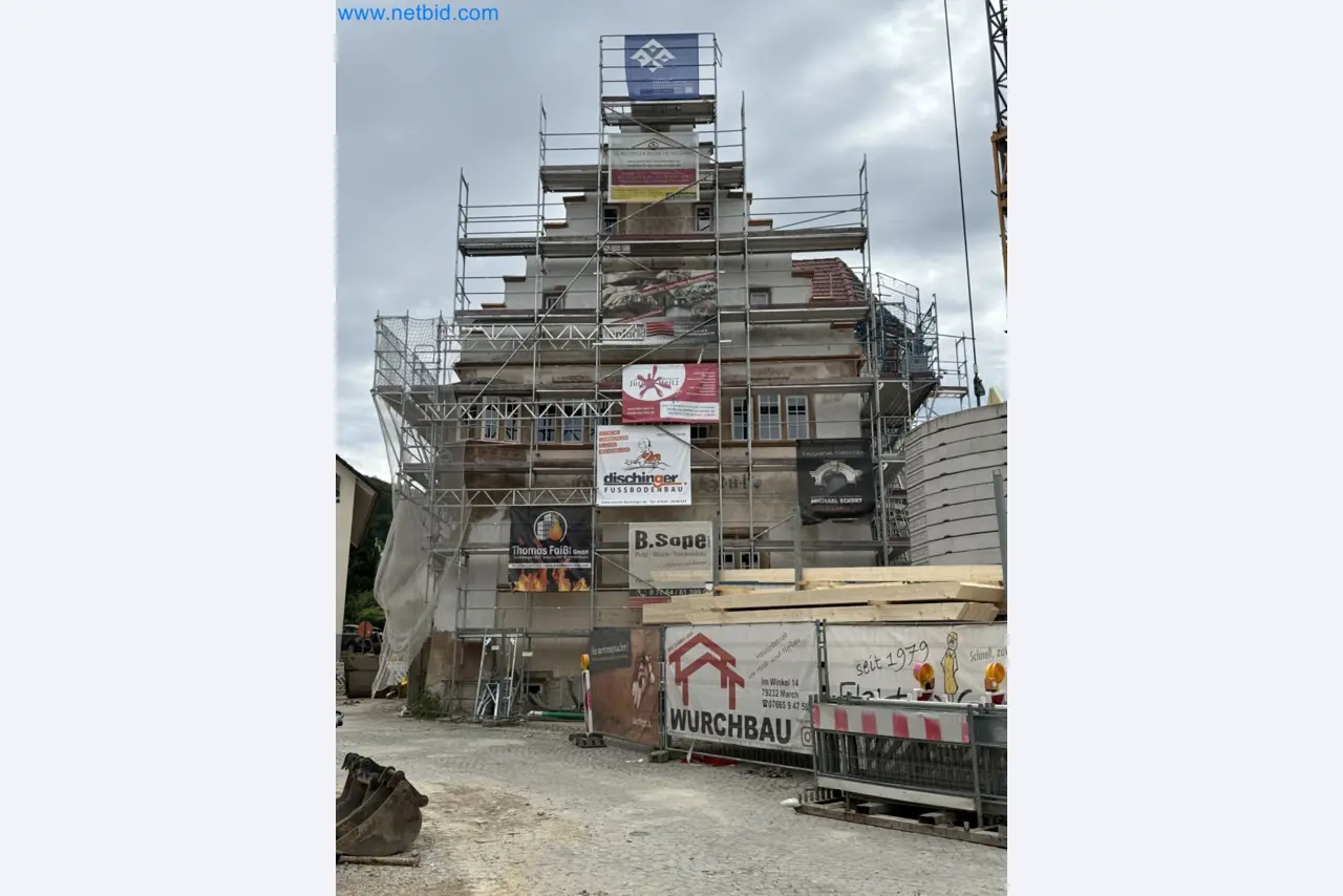 Scaffolding components (some from the construction site), machinery, and vehicles belonging to a construction company-1
