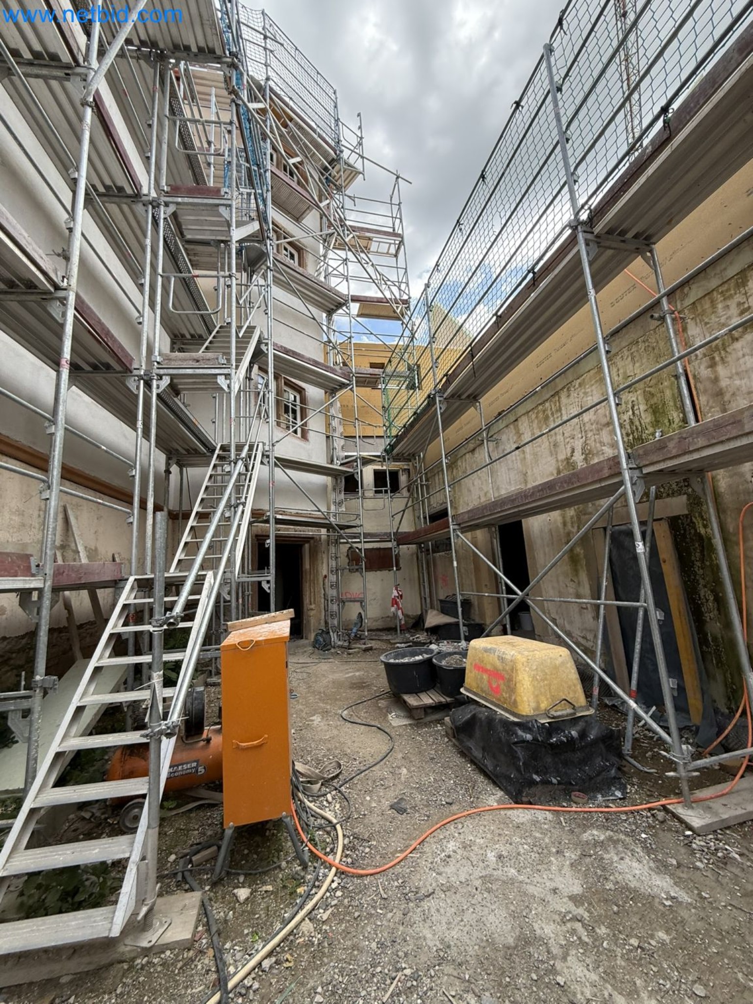 Scaffolding components (some from the construction site), machinery, and vehicles belonging to a construction company-4