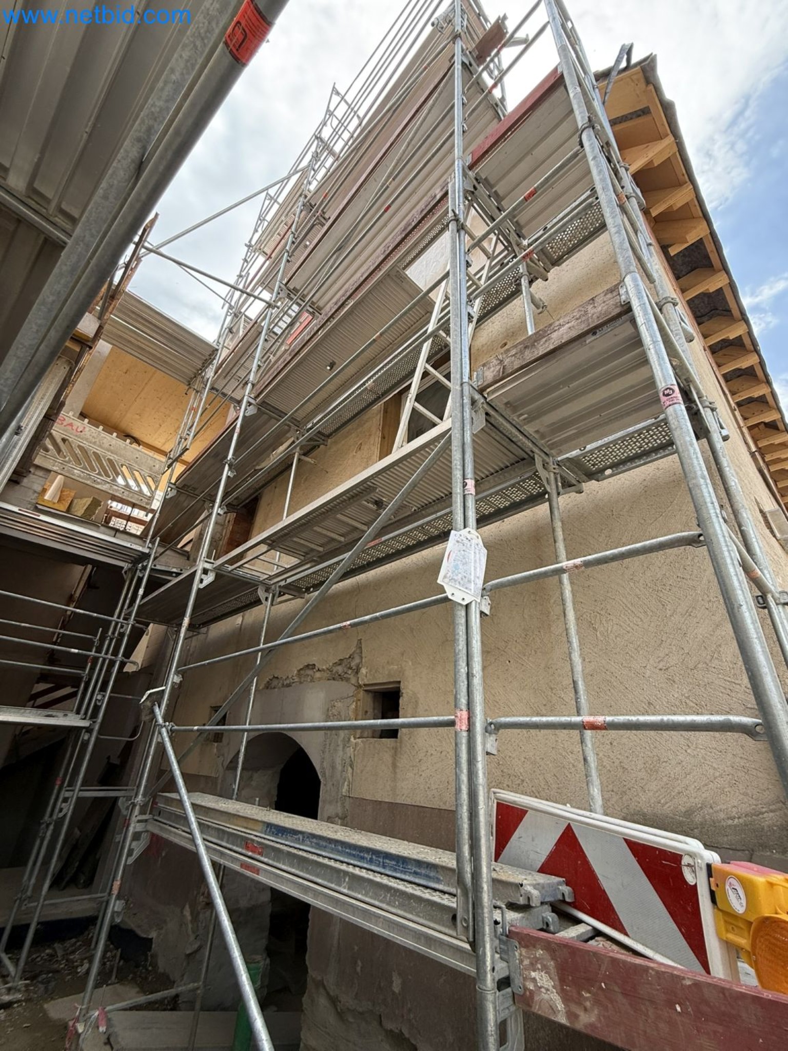 Scaffolding components (some from the construction site), machinery, and vehicles belonging to a construction company-5