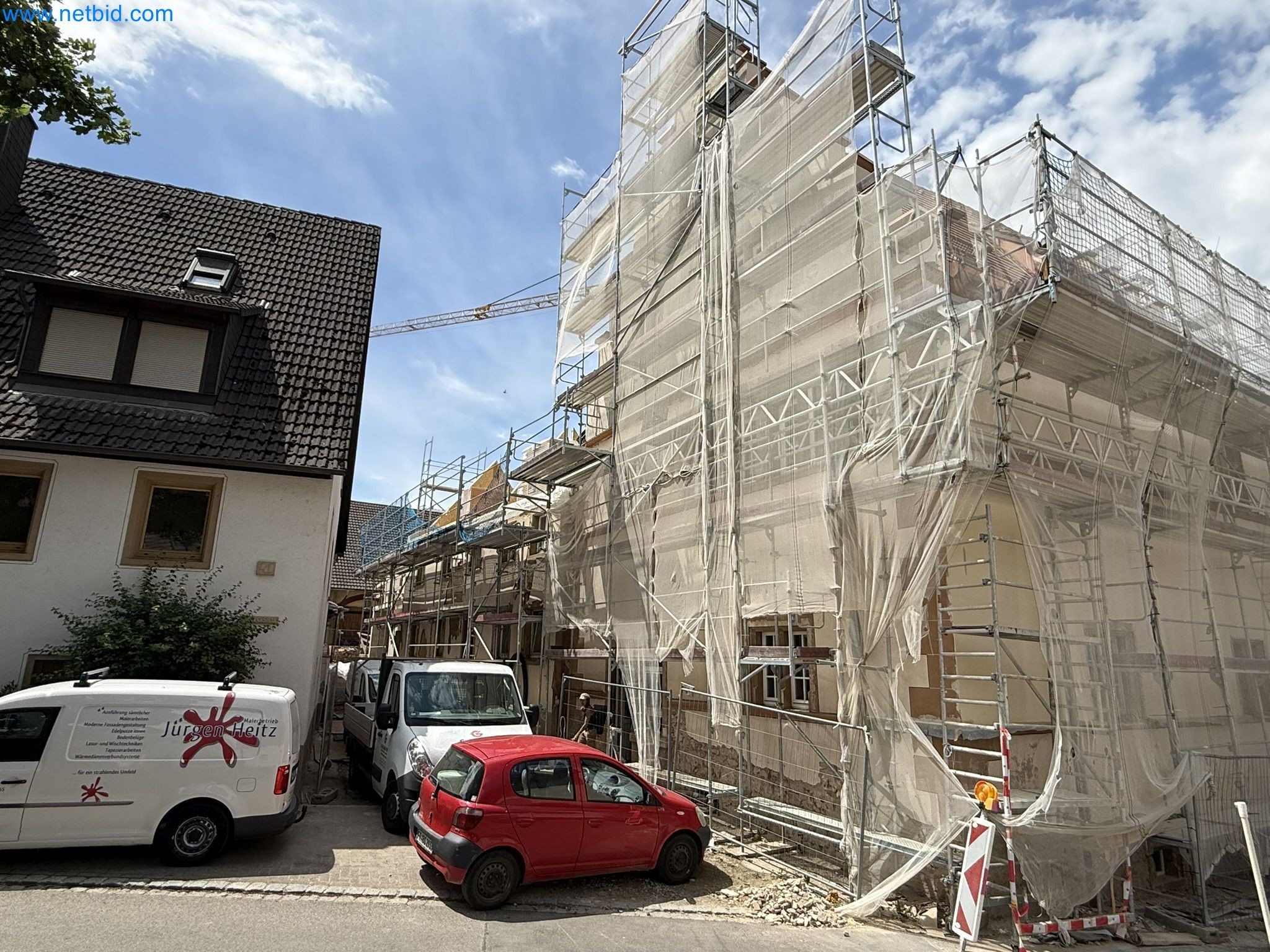 Scaffolding components (some from the construction site), machinery, and vehicles belonging to a construction company-6