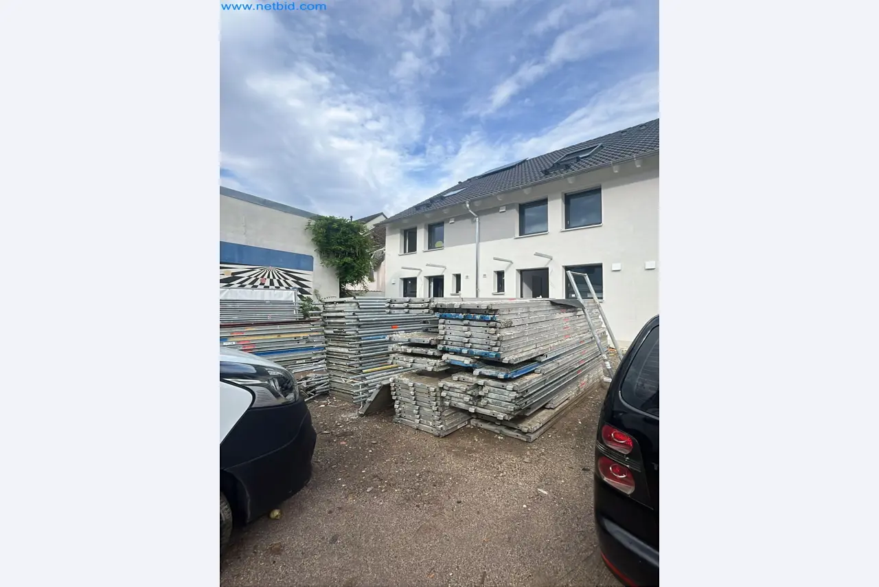 Scaffolding components (some from the construction site), machinery, and vehicles belonging to a construction company-1