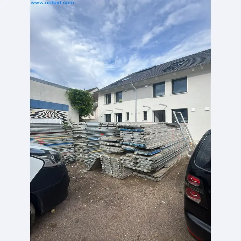 Scaffolding components (some from the construction site), machinery, and vehicles belonging to a construction company-1
