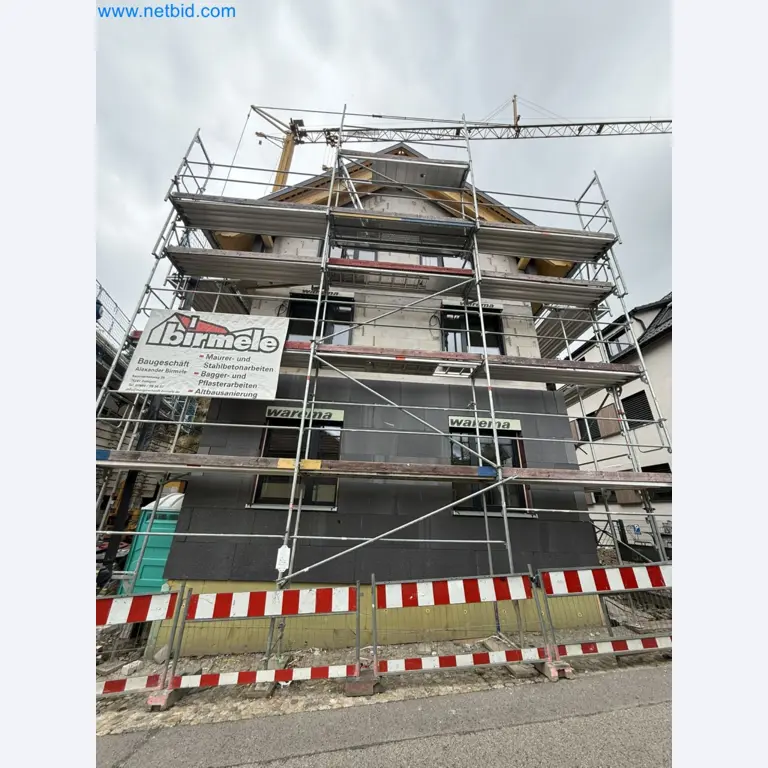 Scaffolding components (some from the construction site), machinery, and vehicles belonging to a construction company-1