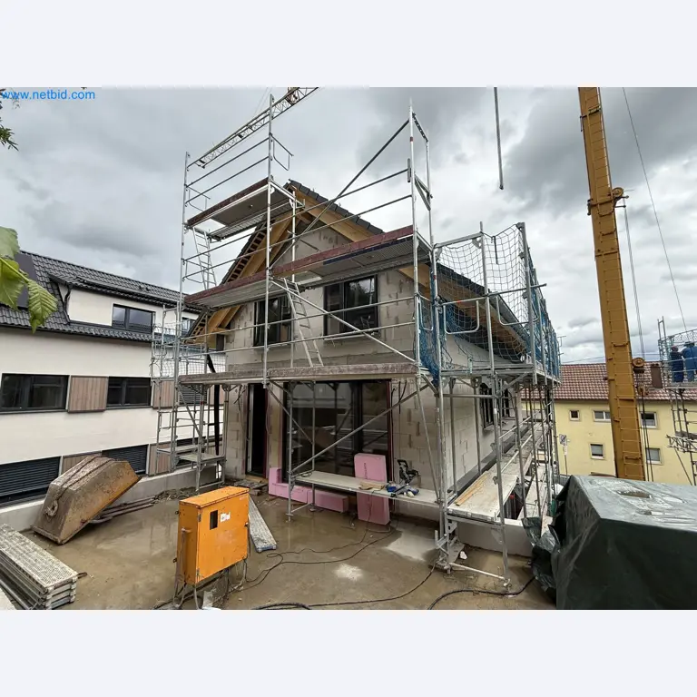 Scaffolding components (some from the construction site), machinery, and vehicles belonging to a construction company-4