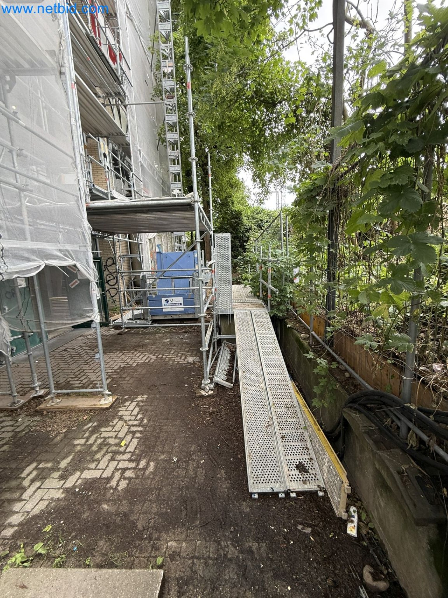 Scaffolding components (some from the construction site), machinery, and vehicles belonging to a construction company-3