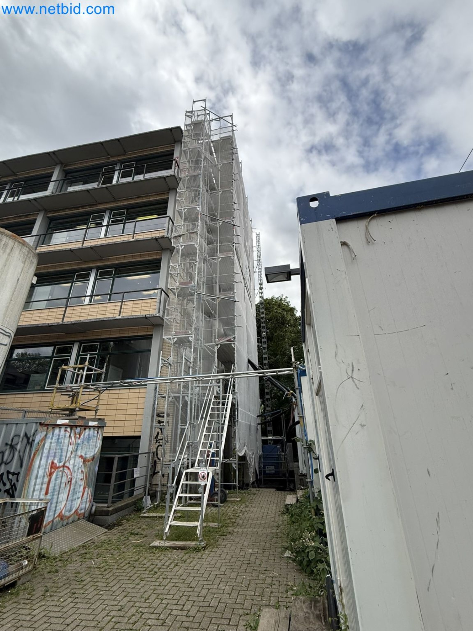 Scaffolding components (some from the construction site), machinery, and vehicles belonging to a construction company-7