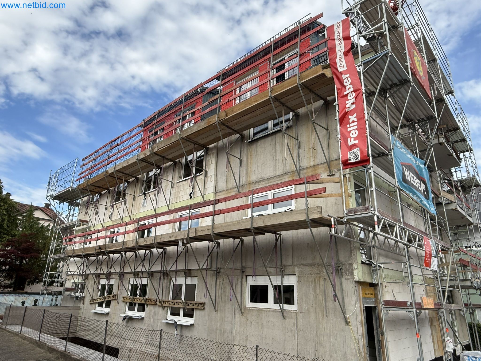 Scaffolding components (some from the construction site), machinery, and vehicles belonging to a construction company-1