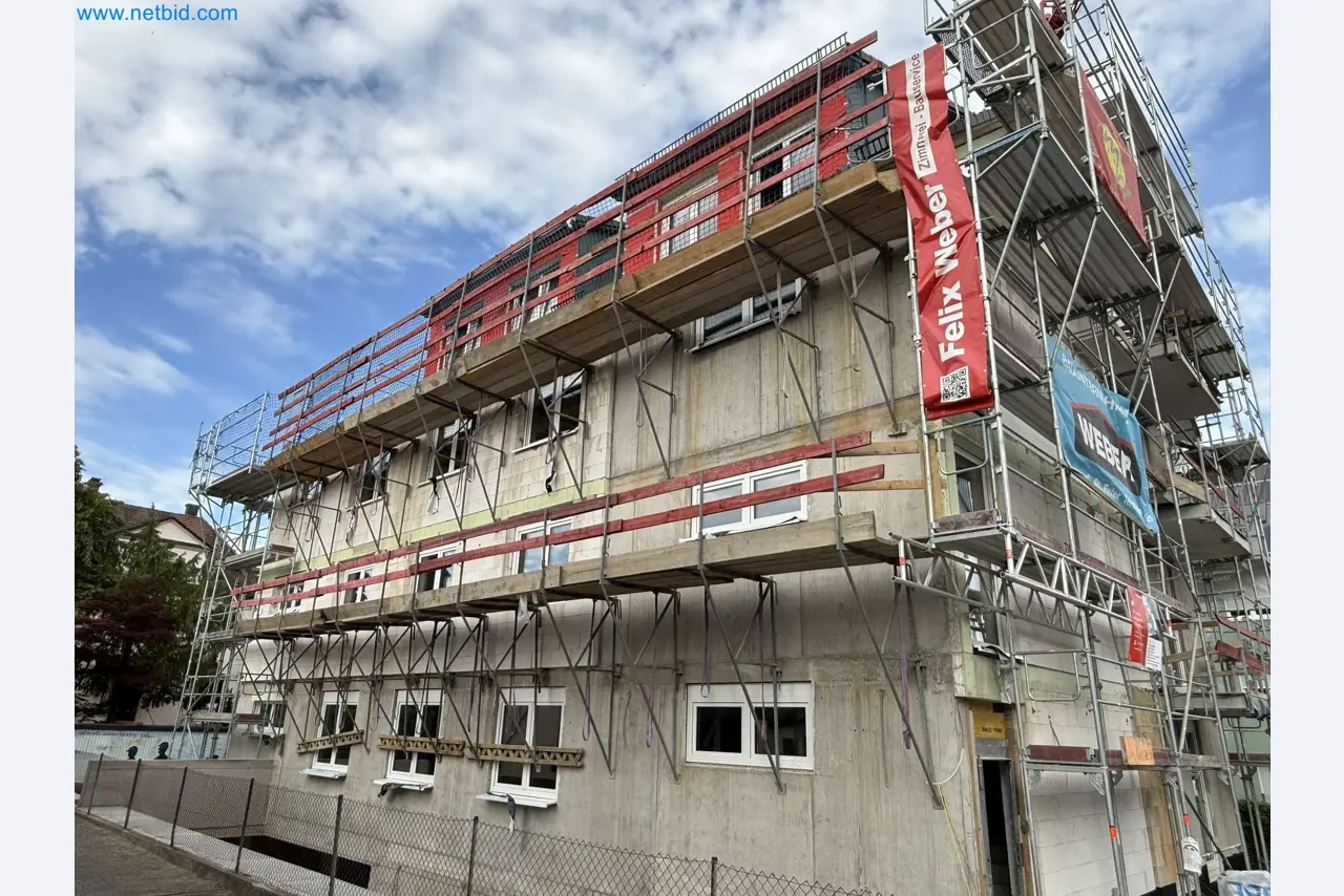 Scaffolding components (some from the construction site), machinery, and vehicles belonging to a construction company-1