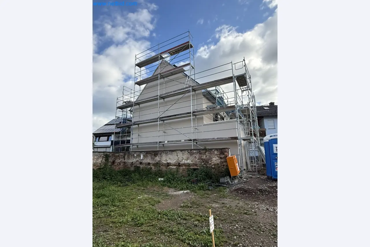 Scaffolding components (some from the construction site), machinery, and vehicles belonging to a construction company-2