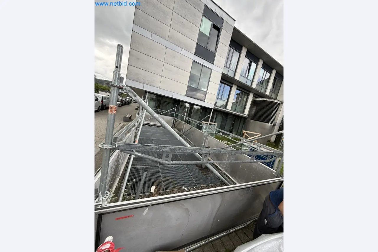 Scaffolding components (some from the construction site), machinery, and vehicles belonging to a construction company-2