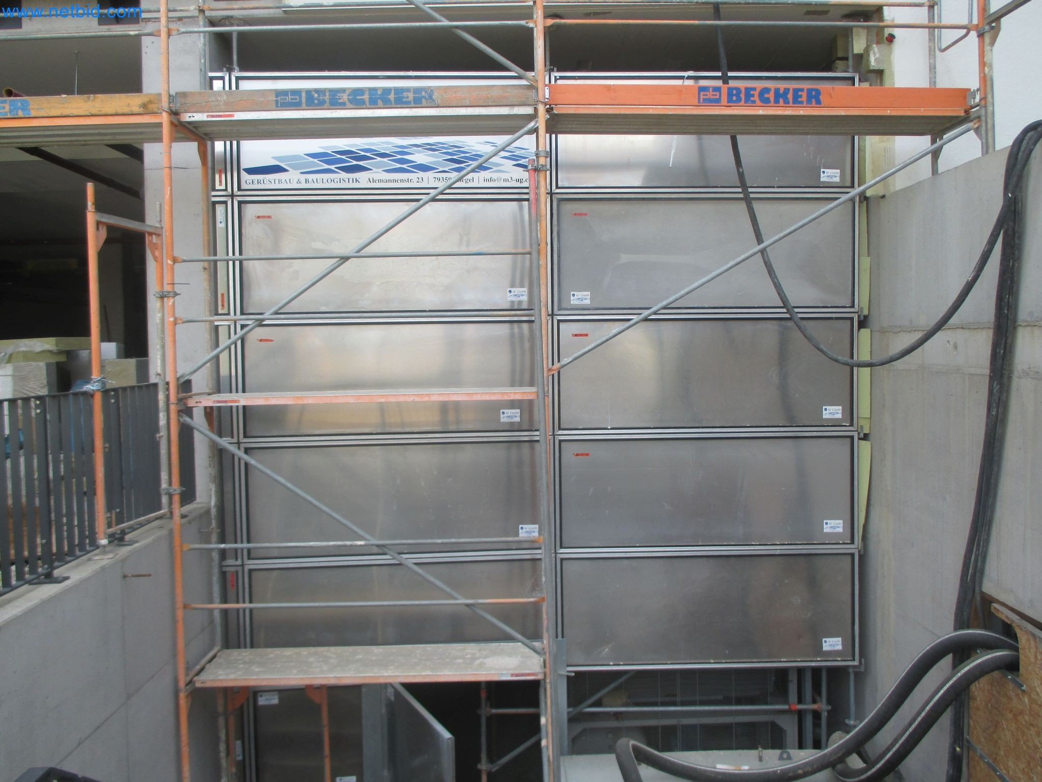 Scaffolding components (some from the construction site), machinery, and vehicles belonging to a construction company-1