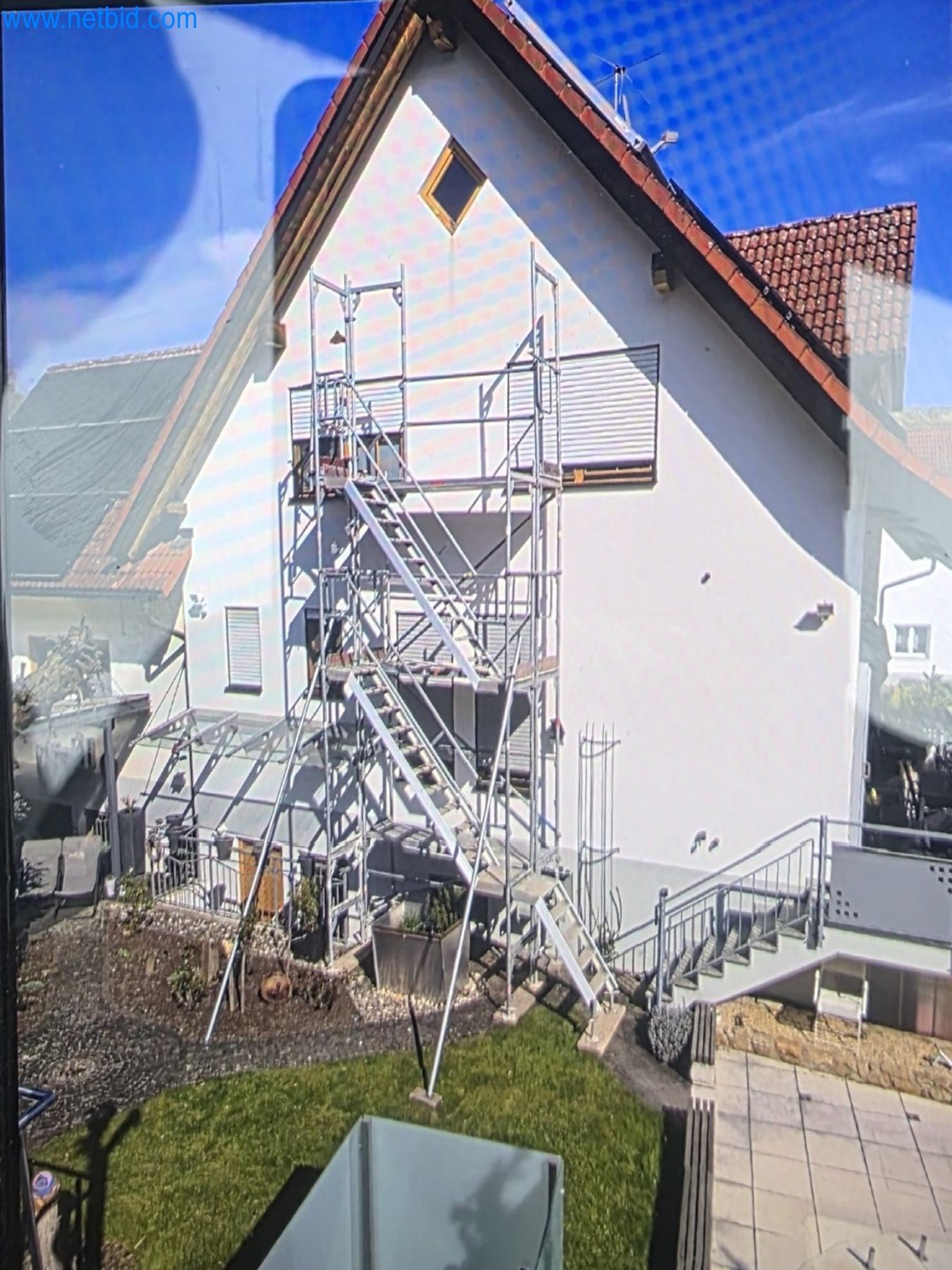 Scaffolding components (some from the construction site), machinery, and vehicles belonging to a construction company-1