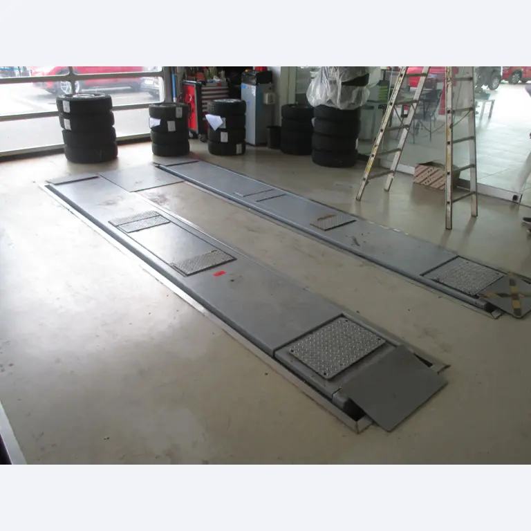 Passenger cars, electric cars, and automotive repair shop equipment at a Fiat dealership-1