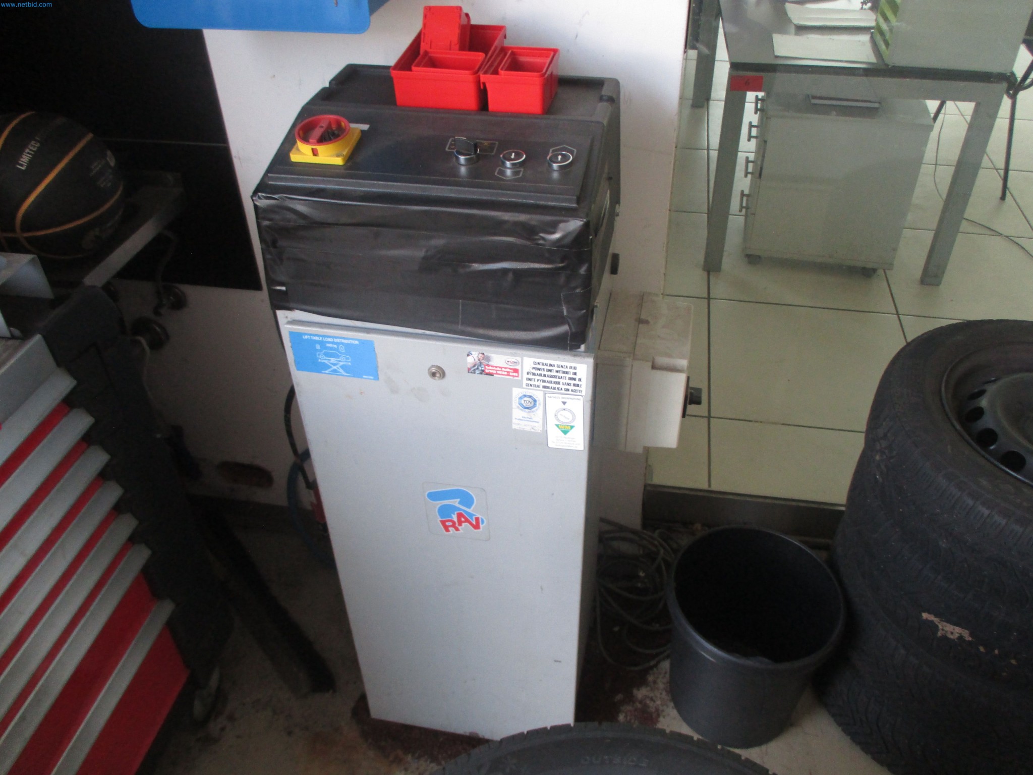 Passenger cars, electric cars, and automotive repair shop equipment at a Fiat dealership-2