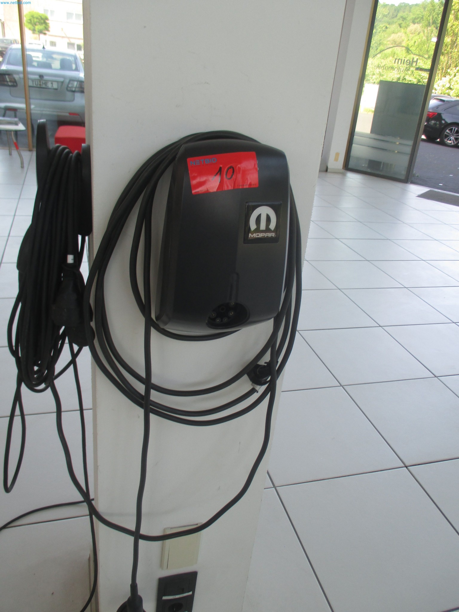 Passenger cars, electric cars, and automotive repair shop equipment at a Fiat dealership-1