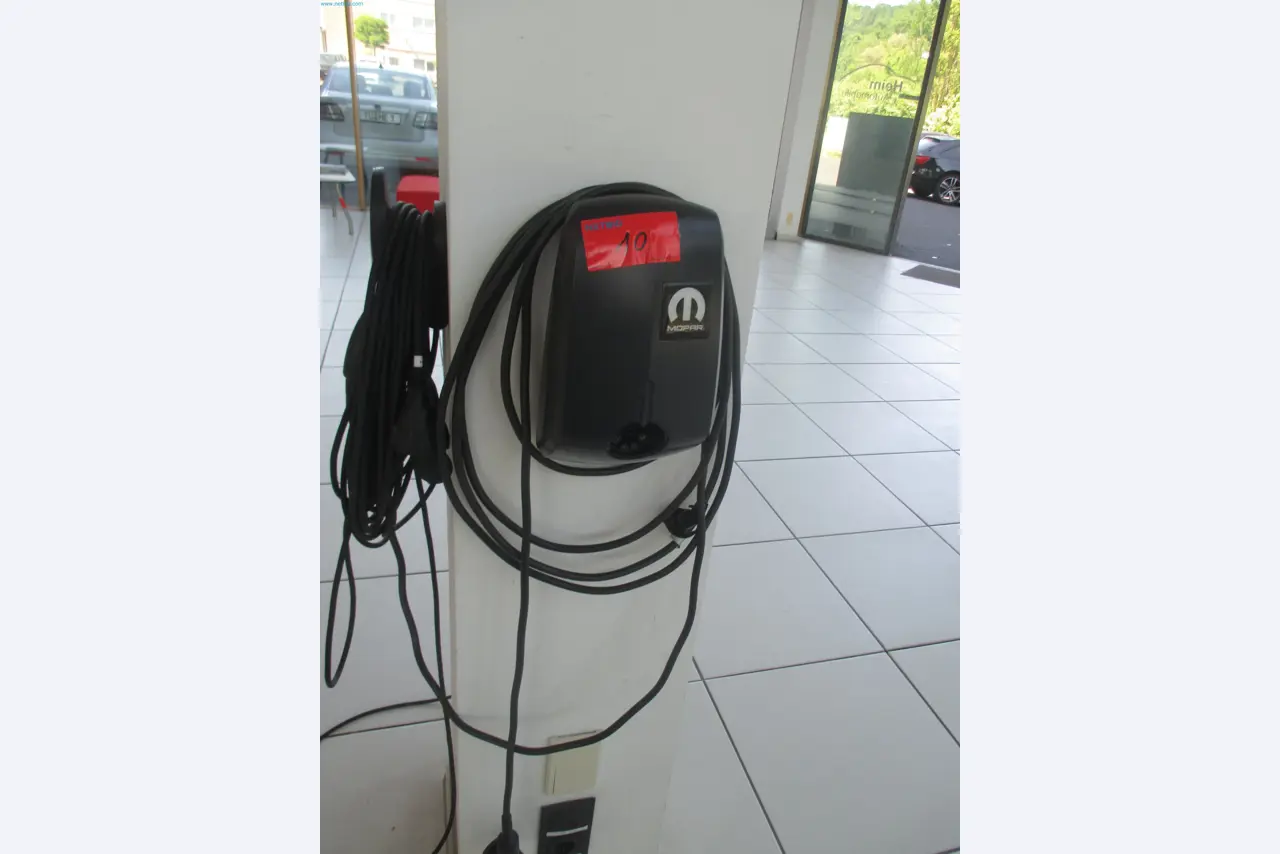 Passenger cars, electric cars, and automotive repair shop equipment at a Fiat dealership-1