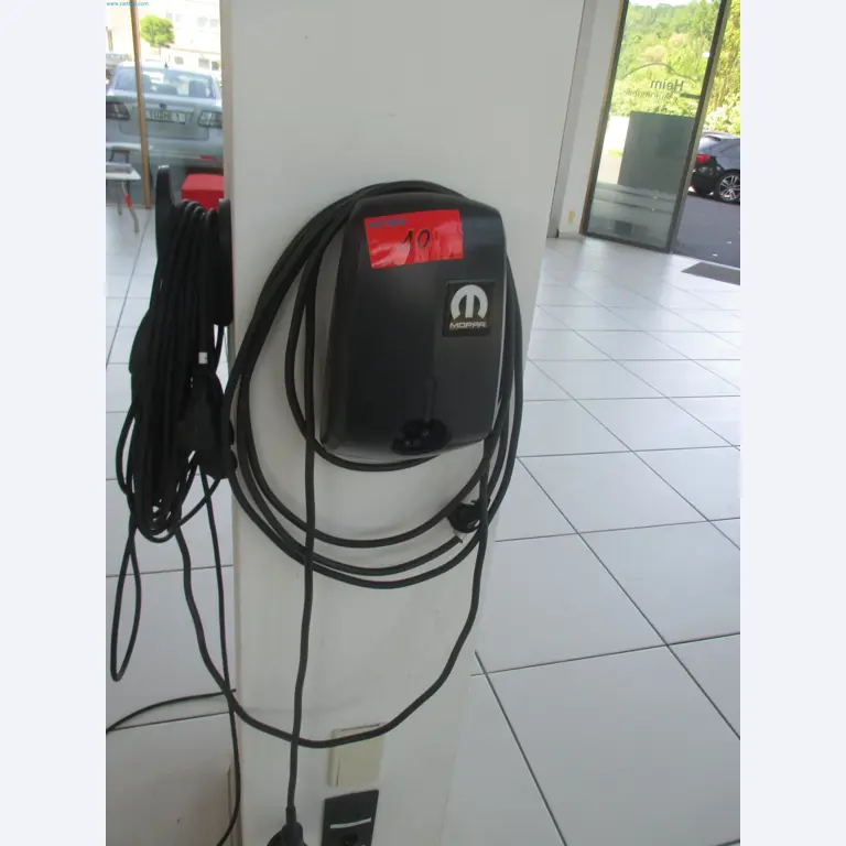 Passenger cars, electric cars, and automotive repair shop equipment at a Fiat dealership-1