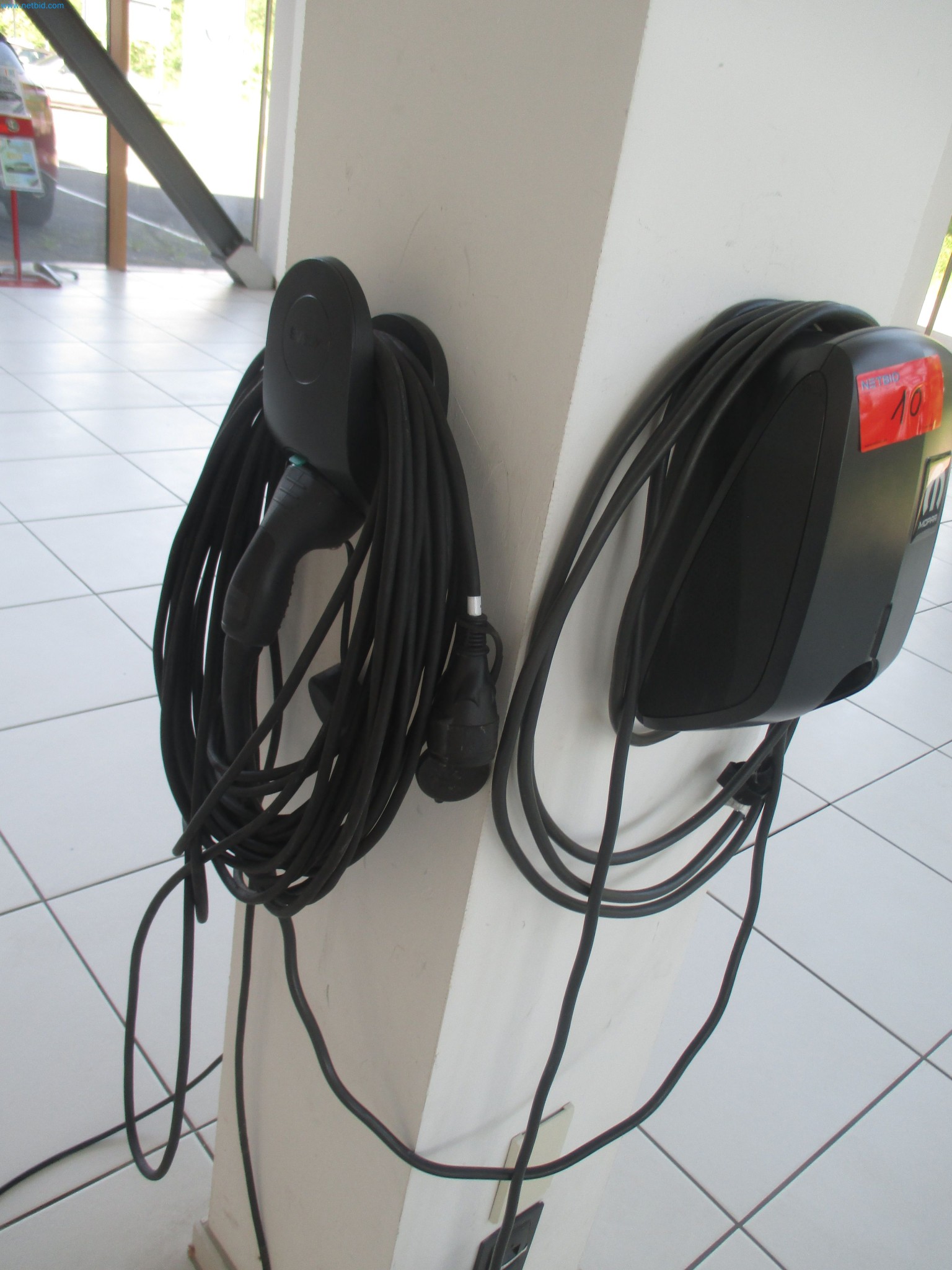 Passenger cars, electric cars, and automotive repair shop equipment at a Fiat dealership-3