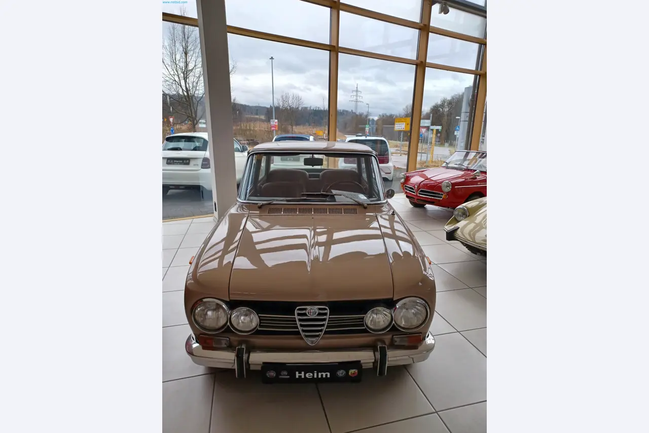 Passenger cars, electric cars, and automotive repair shop equipment at a Fiat dealership-1