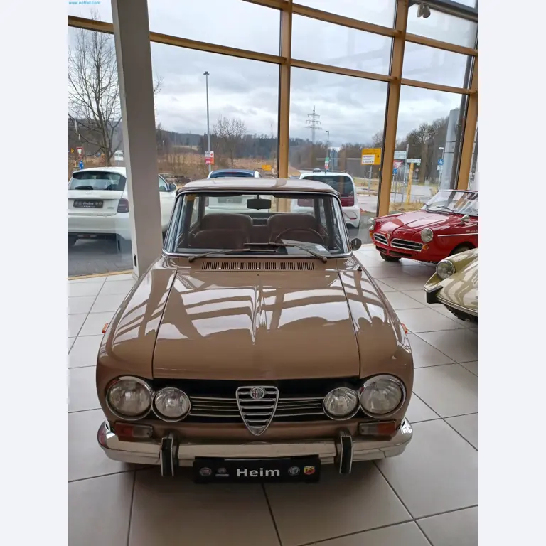 Passenger cars, electric cars, and automotive repair shop equipment at a Fiat dealership-1