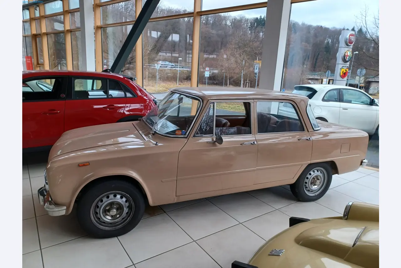 Passenger cars, electric cars, and automotive repair shop equipment at a Fiat dealership-2