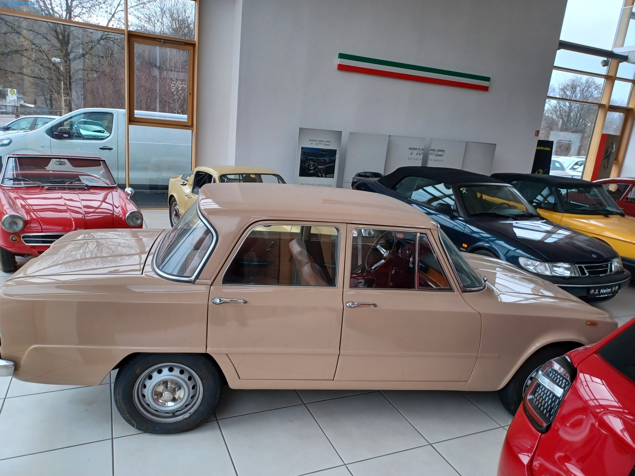 Passenger cars, electric cars, and automotive repair shop equipment at a Fiat dealership-3