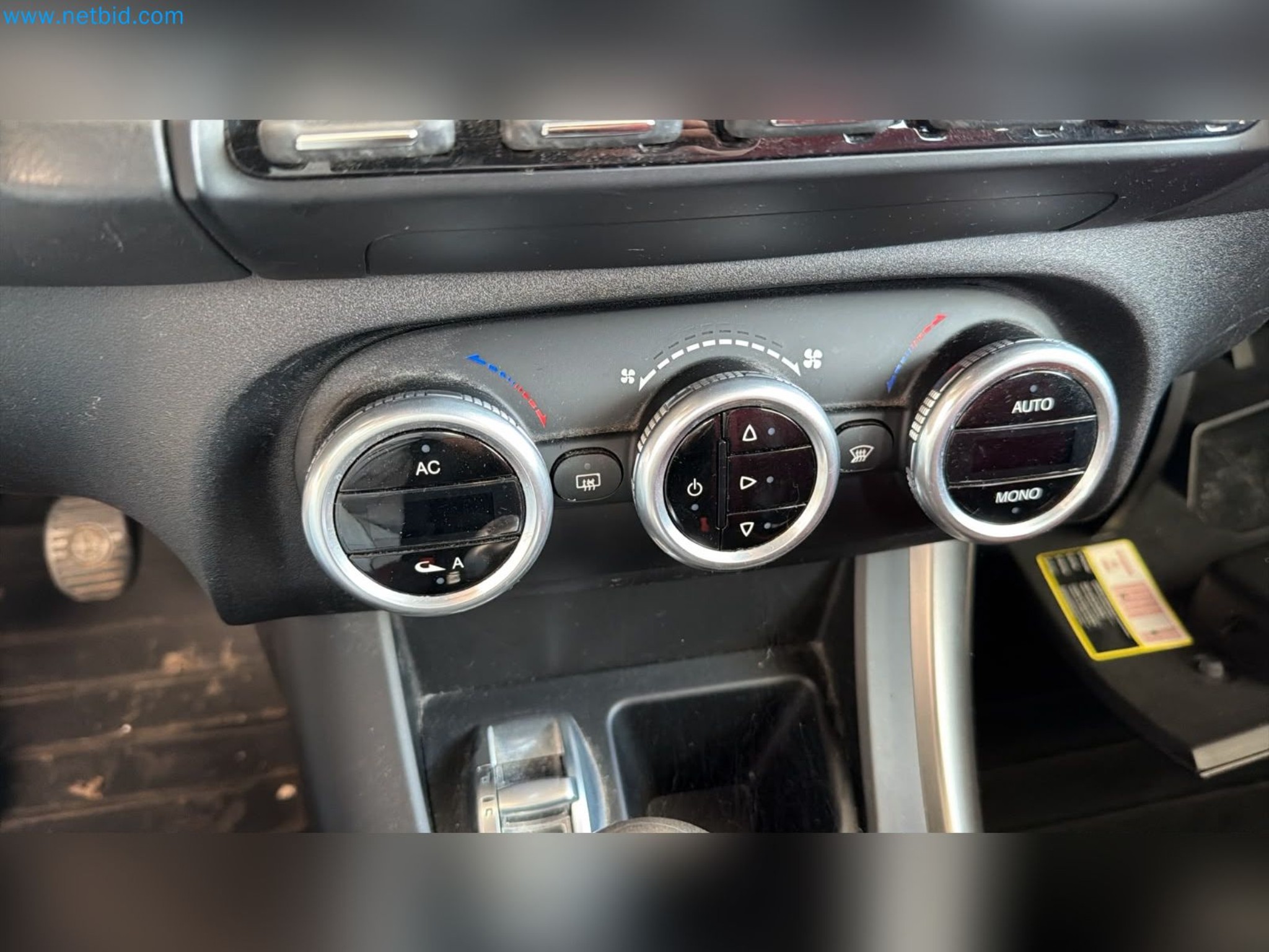 Passenger cars, electric cars, and automotive repair shop equipment at a Fiat dealership-10