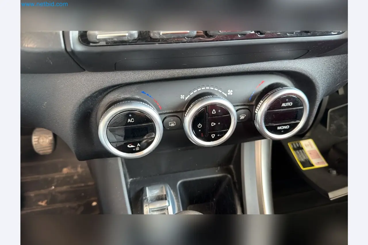 Passenger cars, electric cars, and automotive repair shop equipment at a Fiat dealership-10