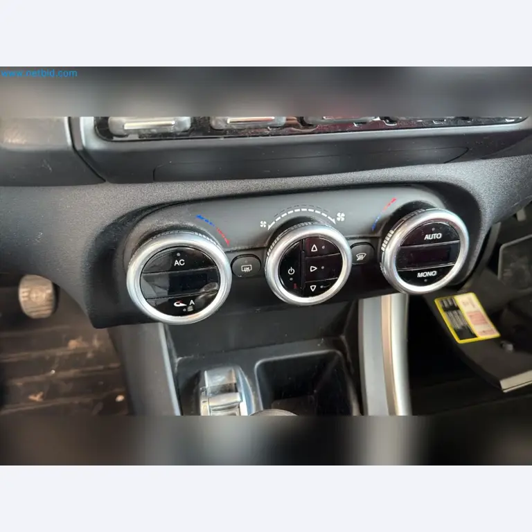 Passenger cars, electric cars, and automotive repair shop equipment at a Fiat dealership-10
