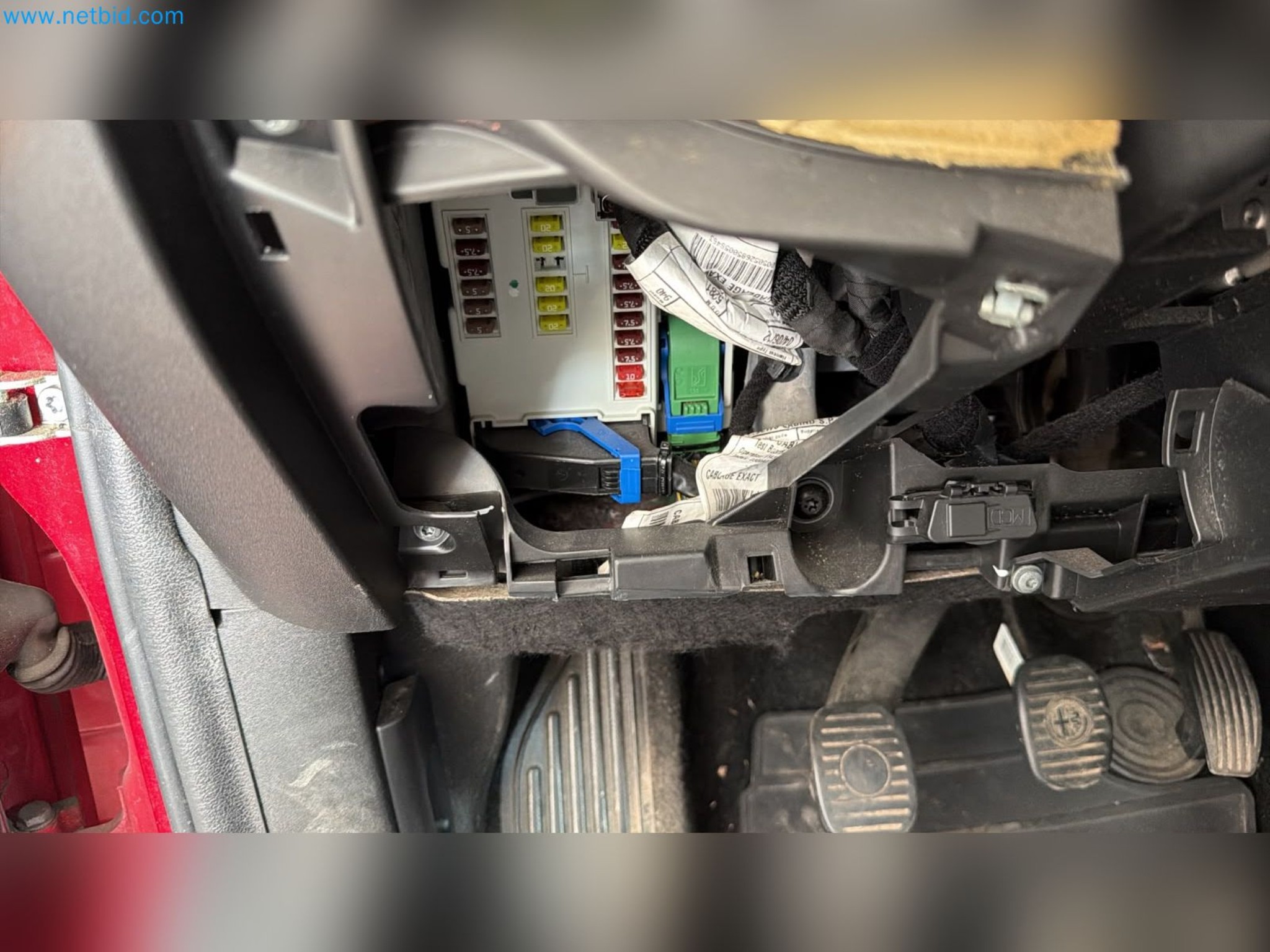 Passenger cars, electric cars, and automotive repair shop equipment at a Fiat dealership-11
