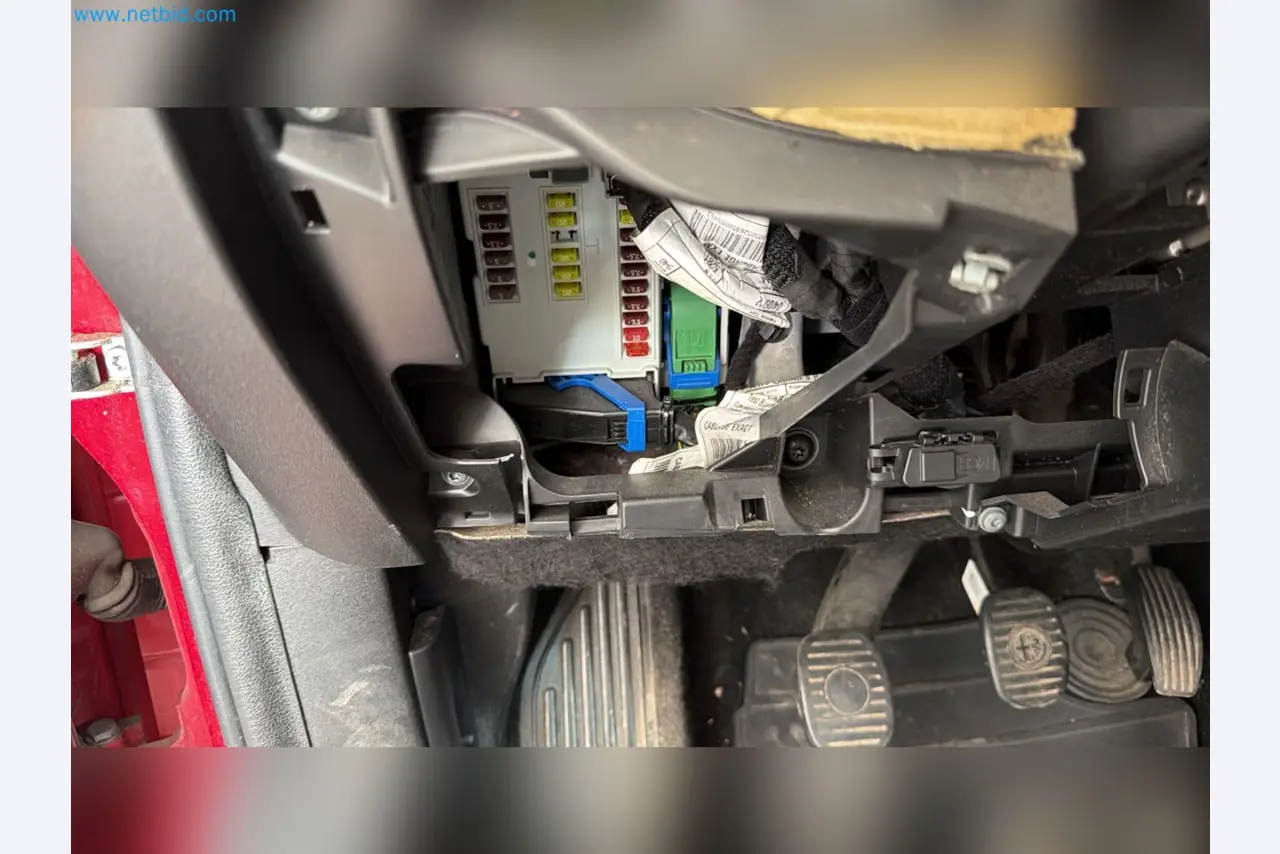 Passenger cars, electric cars, and automotive repair shop equipment at a Fiat dealership-11