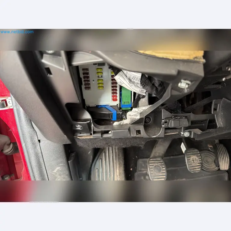 Passenger cars, electric cars, and automotive repair shop equipment at a Fiat dealership-11
