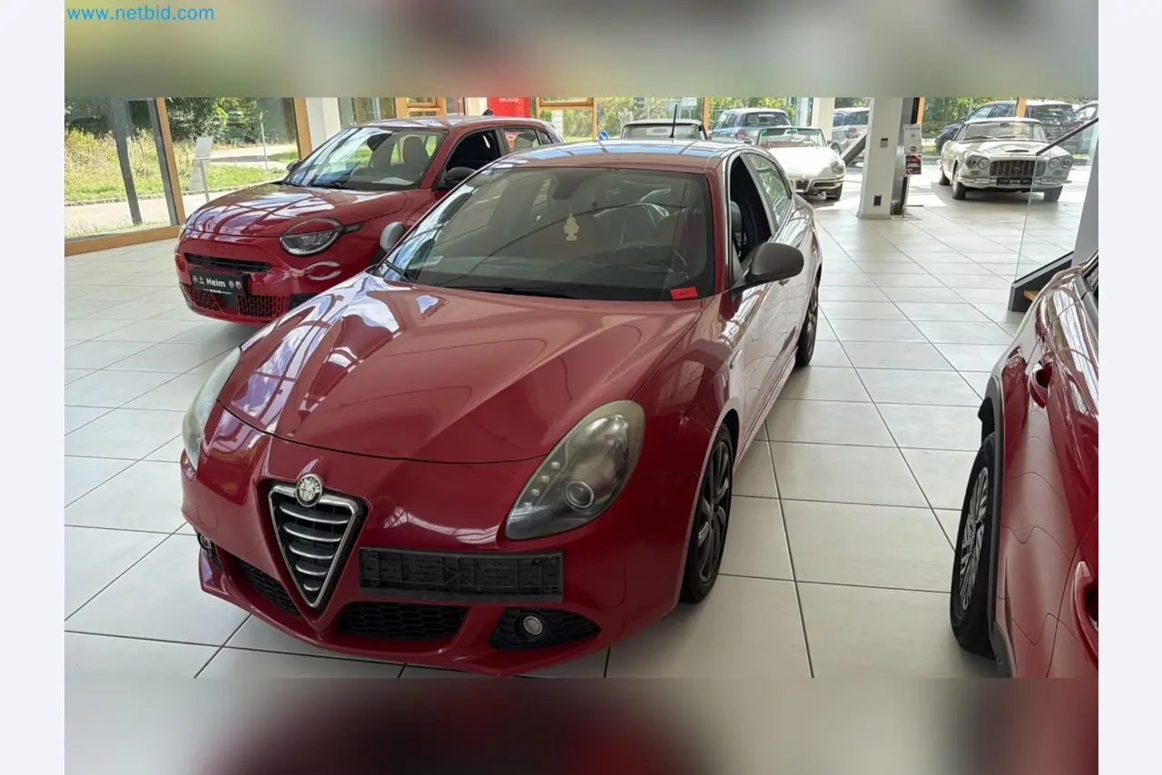 Passenger cars, electric cars, and automotive repair shop equipment at a Fiat dealership-1