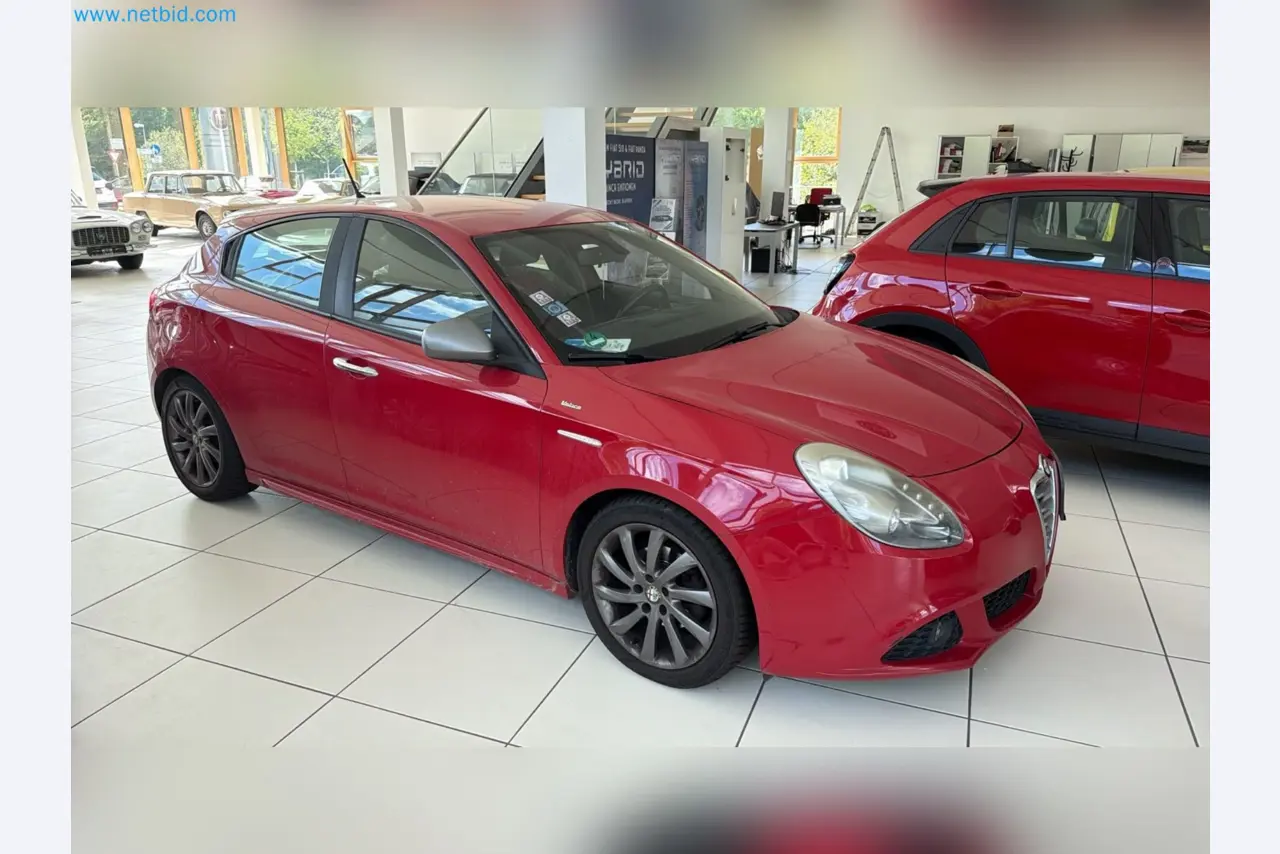 Passenger cars, electric cars, and automotive repair shop equipment at a Fiat dealership-2