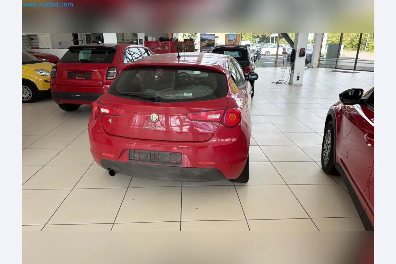 Passenger cars, electric cars, and automotive repair shop equipment at a Fiat dealership-5
