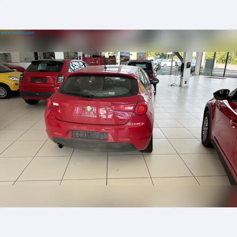 Passenger cars, electric cars, and automotive repair shop equipment at a Fiat dealership-5