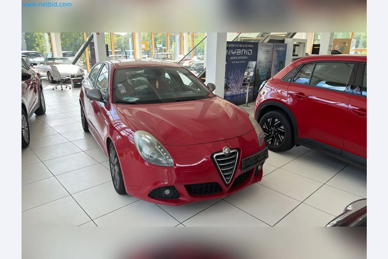 Passenger cars, electric cars, and automotive repair shop equipment at a Fiat dealership-6
