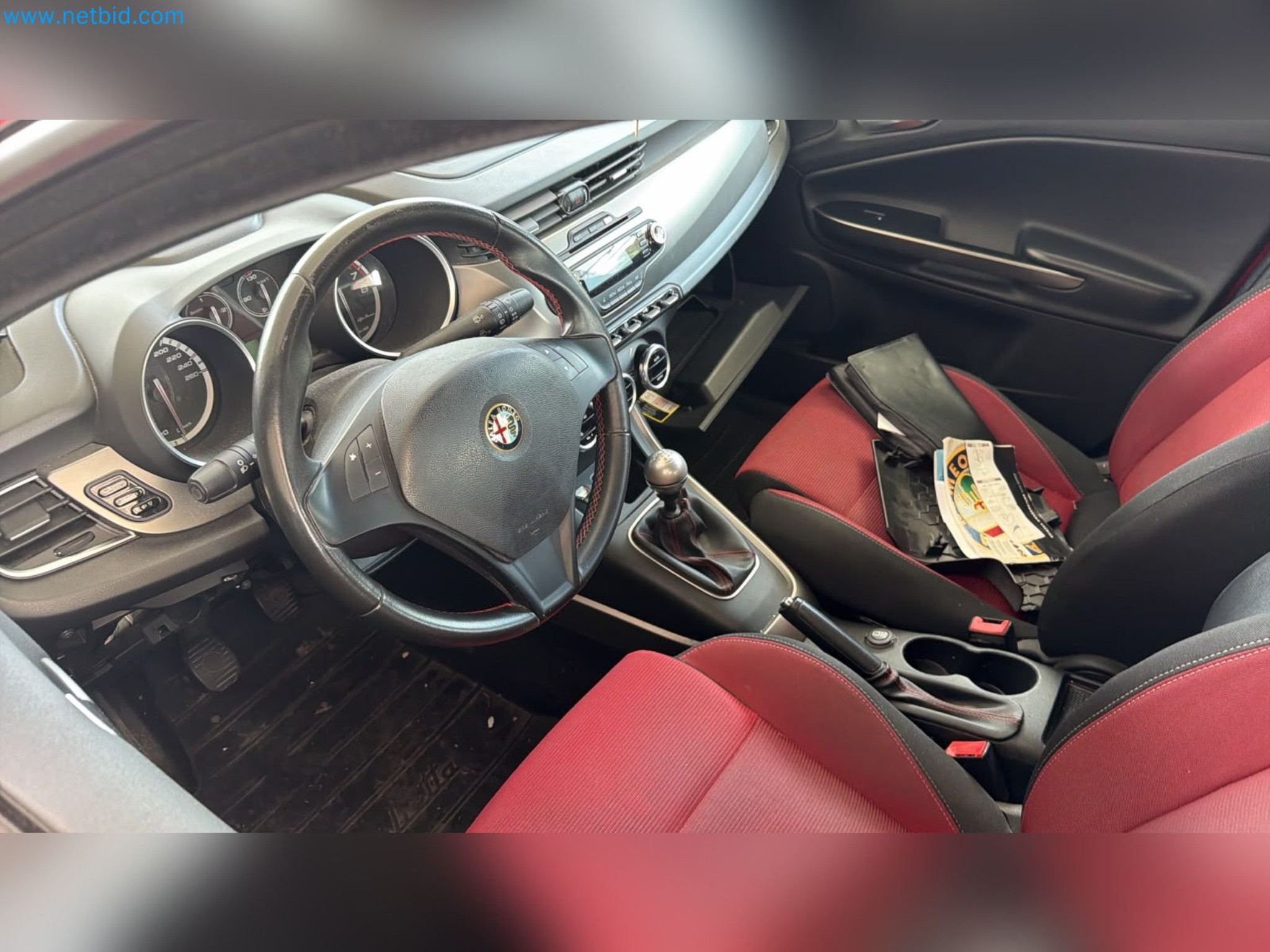 Passenger cars, electric cars, and automotive repair shop equipment at a Fiat dealership-7