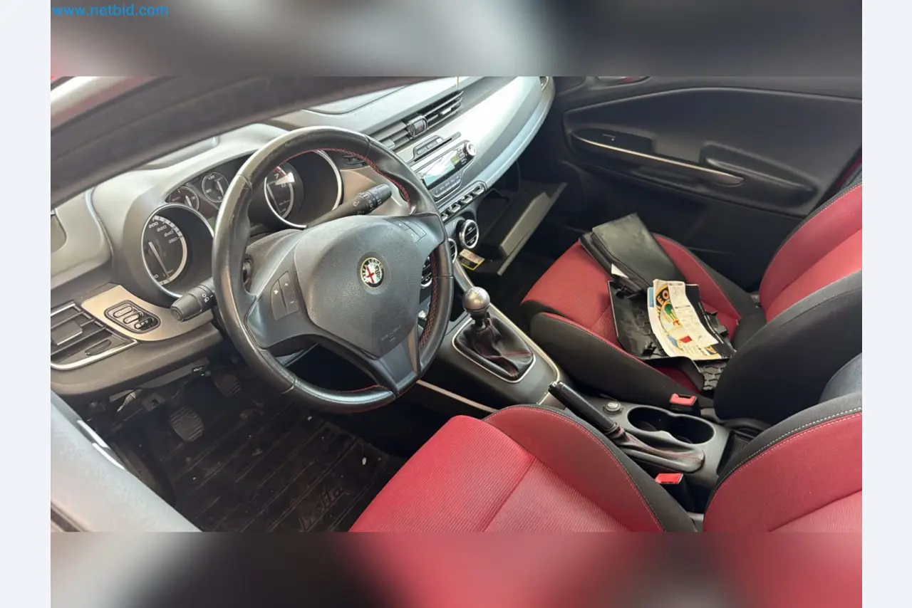 Passenger cars, electric cars, and automotive repair shop equipment at a Fiat dealership-7