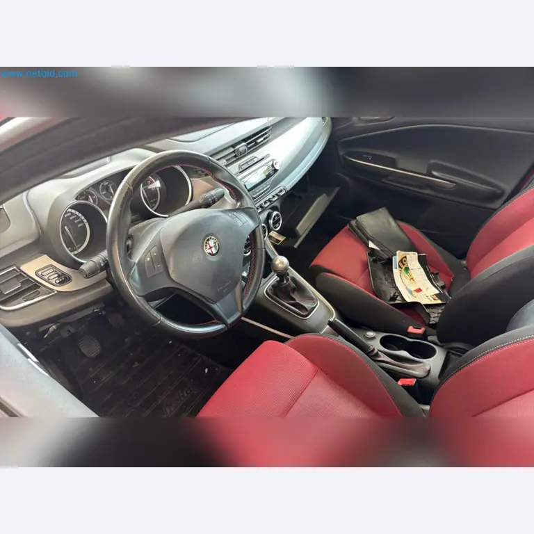 Passenger cars, electric cars, and automotive repair shop equipment at a Fiat dealership-7